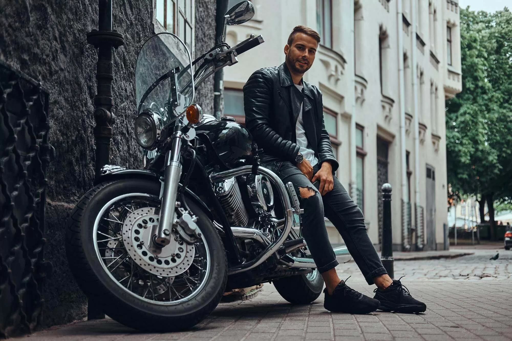 fashionable biker dressed black leather - Thợ Kỹ Thuật
