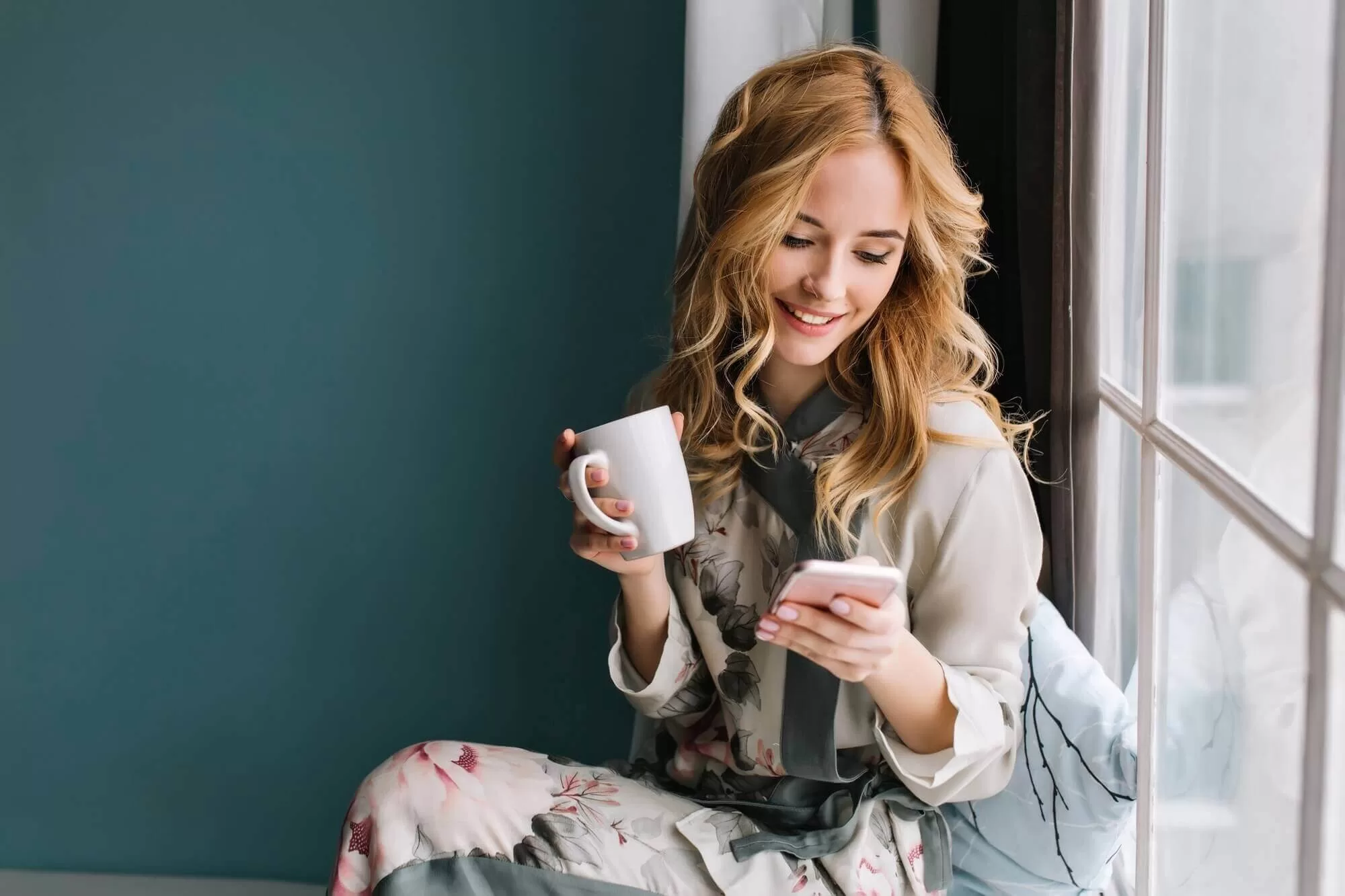 pretty blonde girl sitting window sill with cup - Thợ Kỹ Thuật