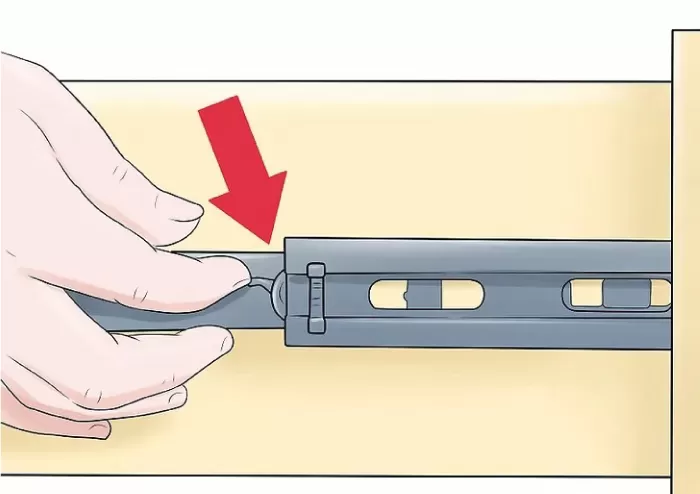 Xác định chốt lẫy trên ray trượt bi để tháo ngăn kéo